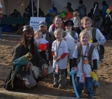 picture of a Captain Jack Sparrow impersonator with a parrot entertaining children at the Snowball Express 2007